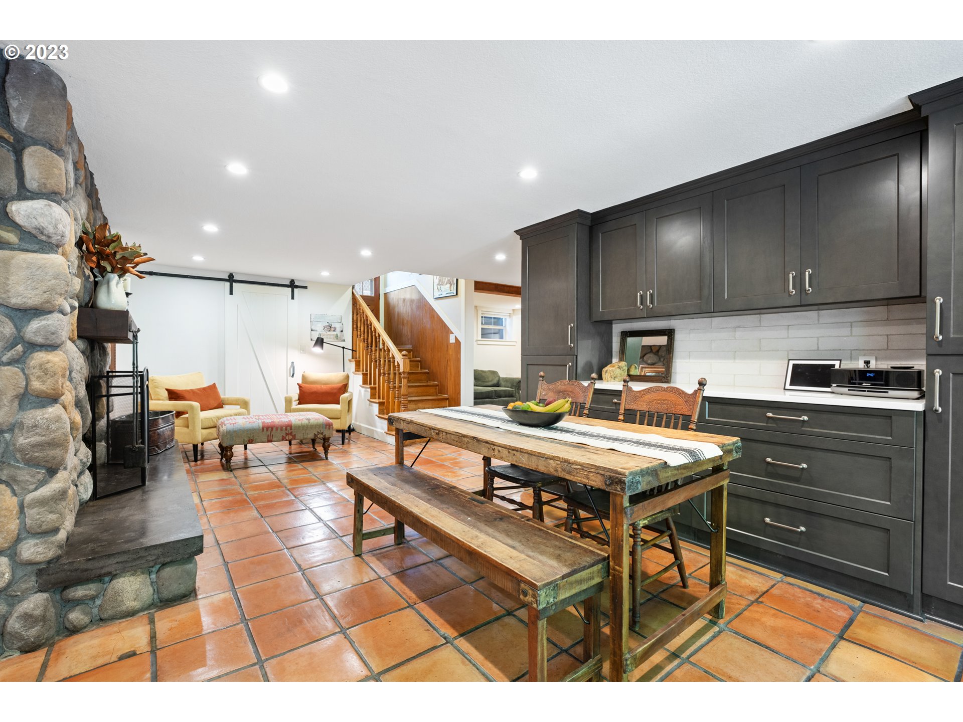 25604 Northeast Manley Road Battle Ground, WA 98604 - Photo 12 of 48 a kitchen with stainless steel appliances kitchen island granite countertop a stove a sink and a refrigerator