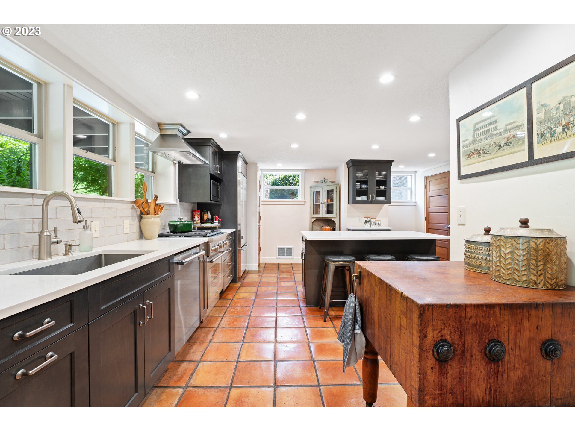 25604 Northeast Manley Road Battle Ground, WA 98604 - Photo 15 of 48 a large kitchen with kitchen island a sink a counter top space and stainless steel appliances
