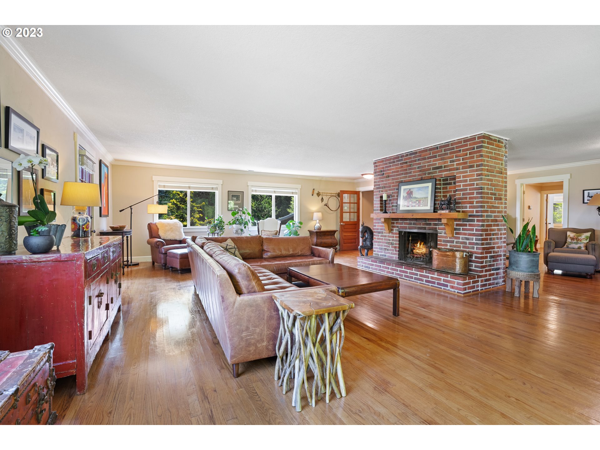 25604 Northeast Manley Road Battle Ground, WA 98604 - Photo 33 of 48 a living room with furniture a fireplace a potted plant and a large window