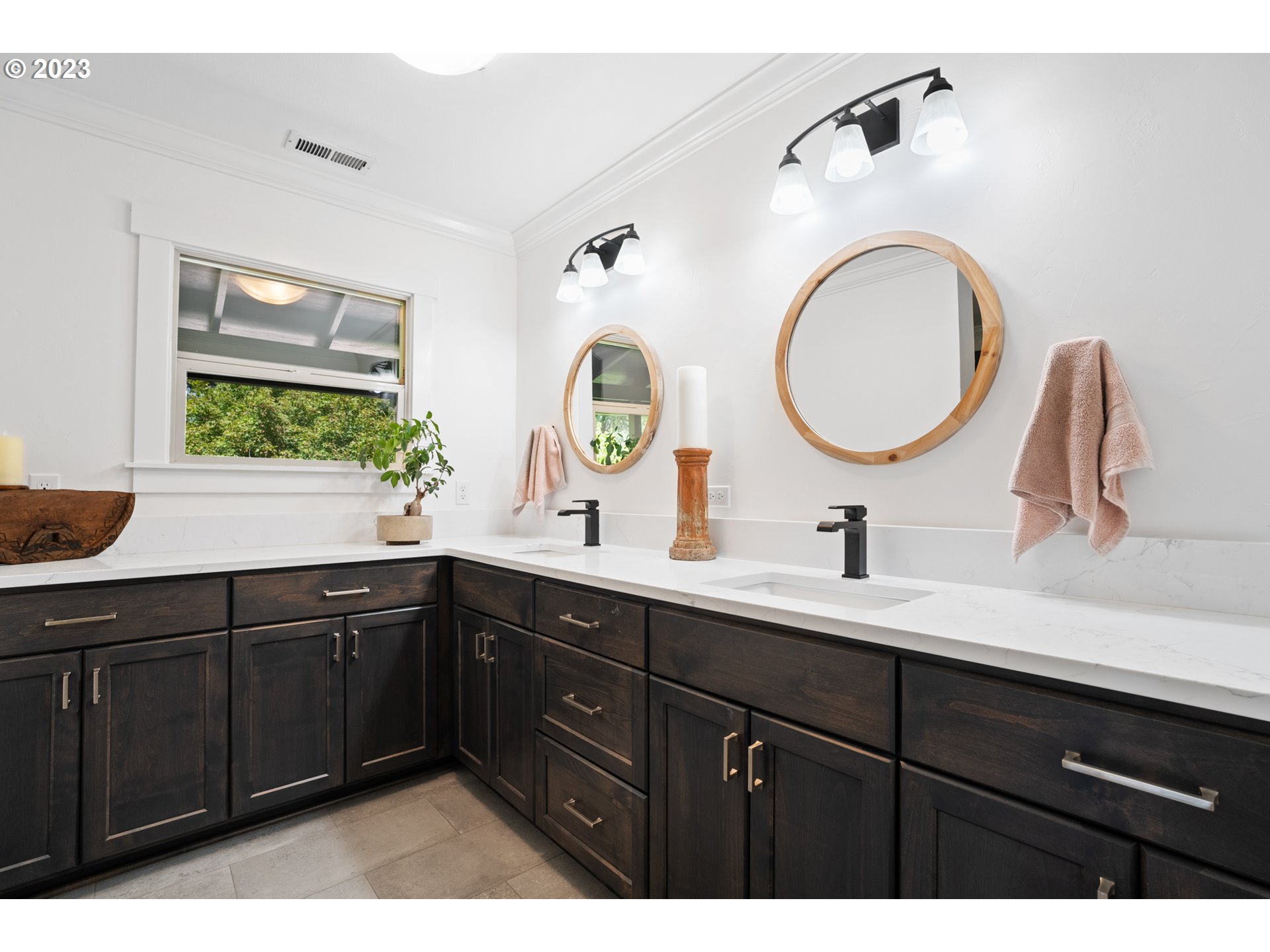 25604 Northeast Manley Road Battle Ground, WA 98604 - Photo 36 of 48 a bathroom with a double vanity sink and a mirror