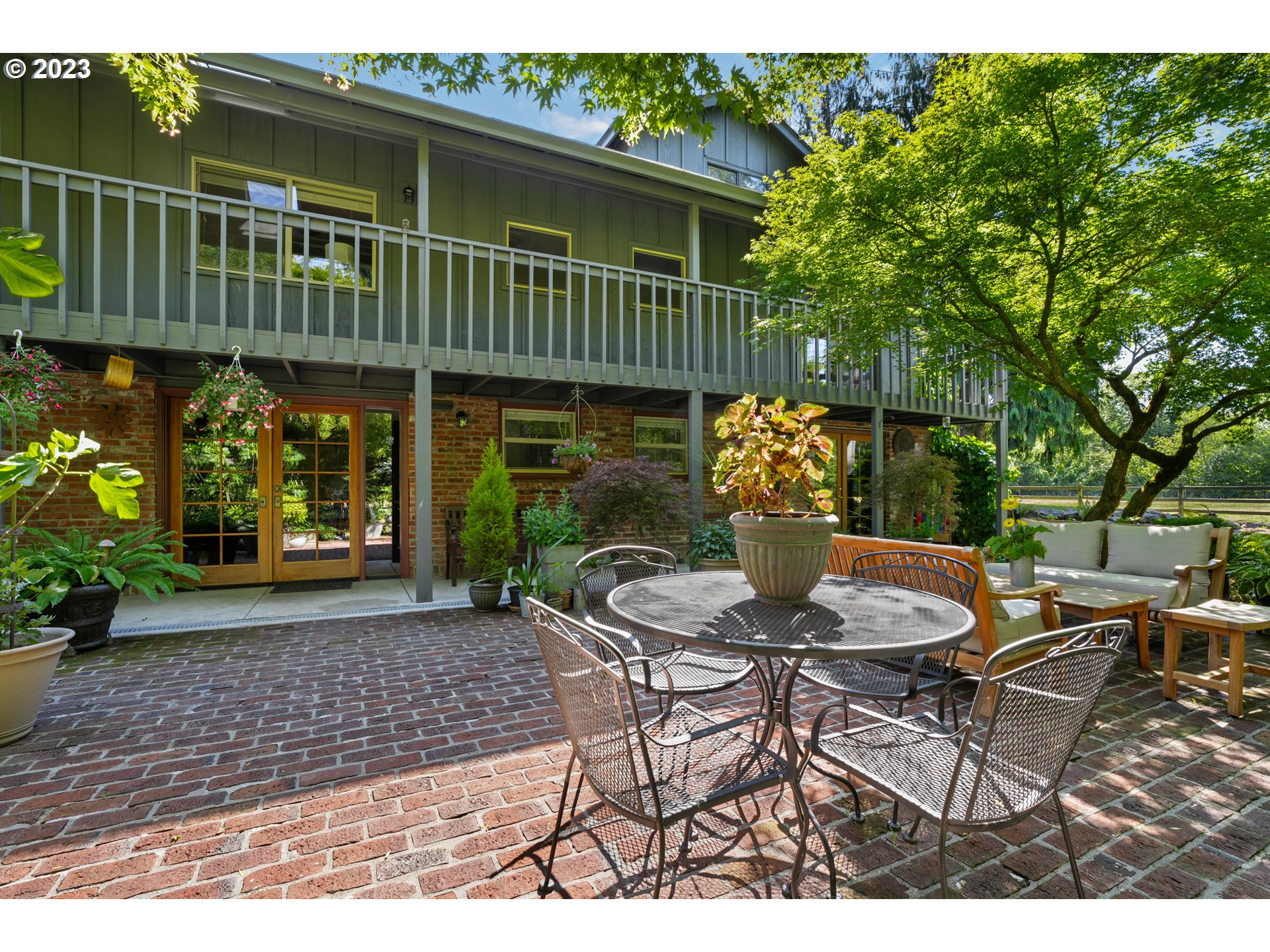 25604 Northeast Manley Road Battle Ground, WA 98604 - Photo 8 of 48 a view of a chair and table in backyard of the house