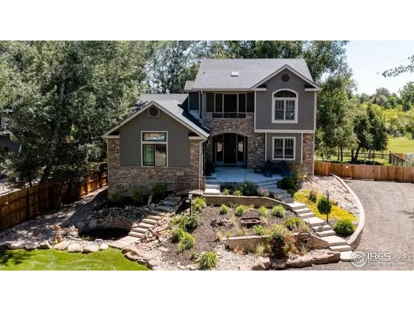 a view of house with backyard outdoor seating and swimming pool