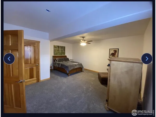 a kitchen with granite countertop a refrigerator a stove and white cabinets