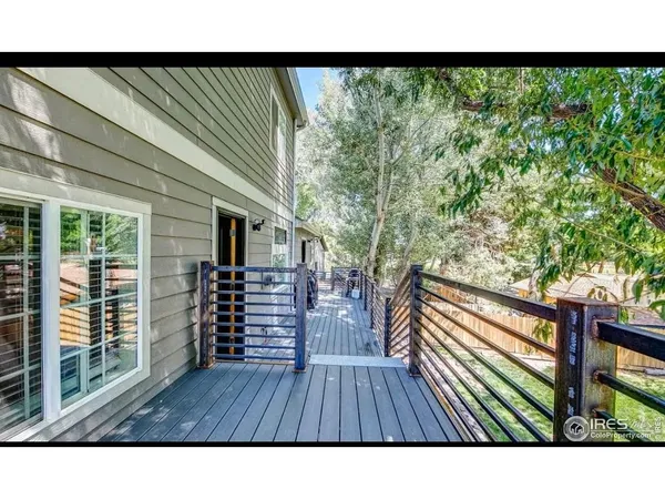 a bathroom with a sink double vanity granite tub shower and a mirror