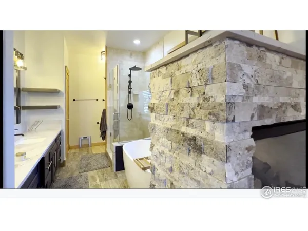 a kitchen with stainless steel appliances kitchen island sink and refrigerator