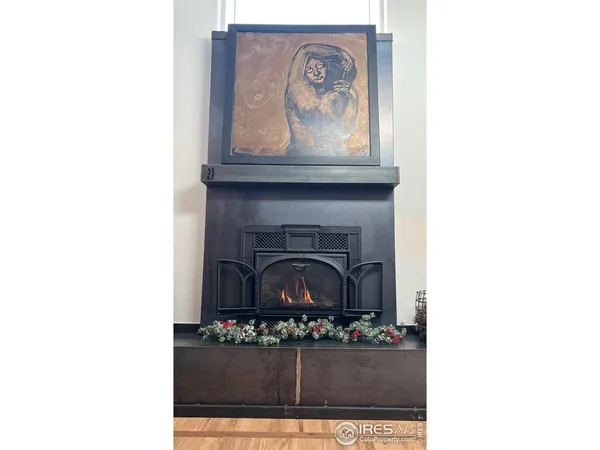 a kitchen with a stove a refrigerator and a microwave