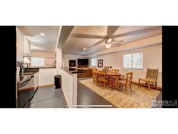 a large bathroom with a large tub and sink