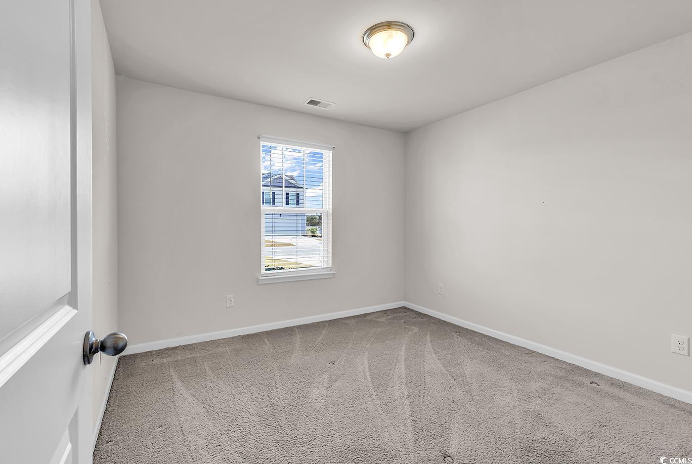 623 Burnt Ash Drive Longs, SC 29568 - Photo 14 of 35 Empty room with carpet and baseboards