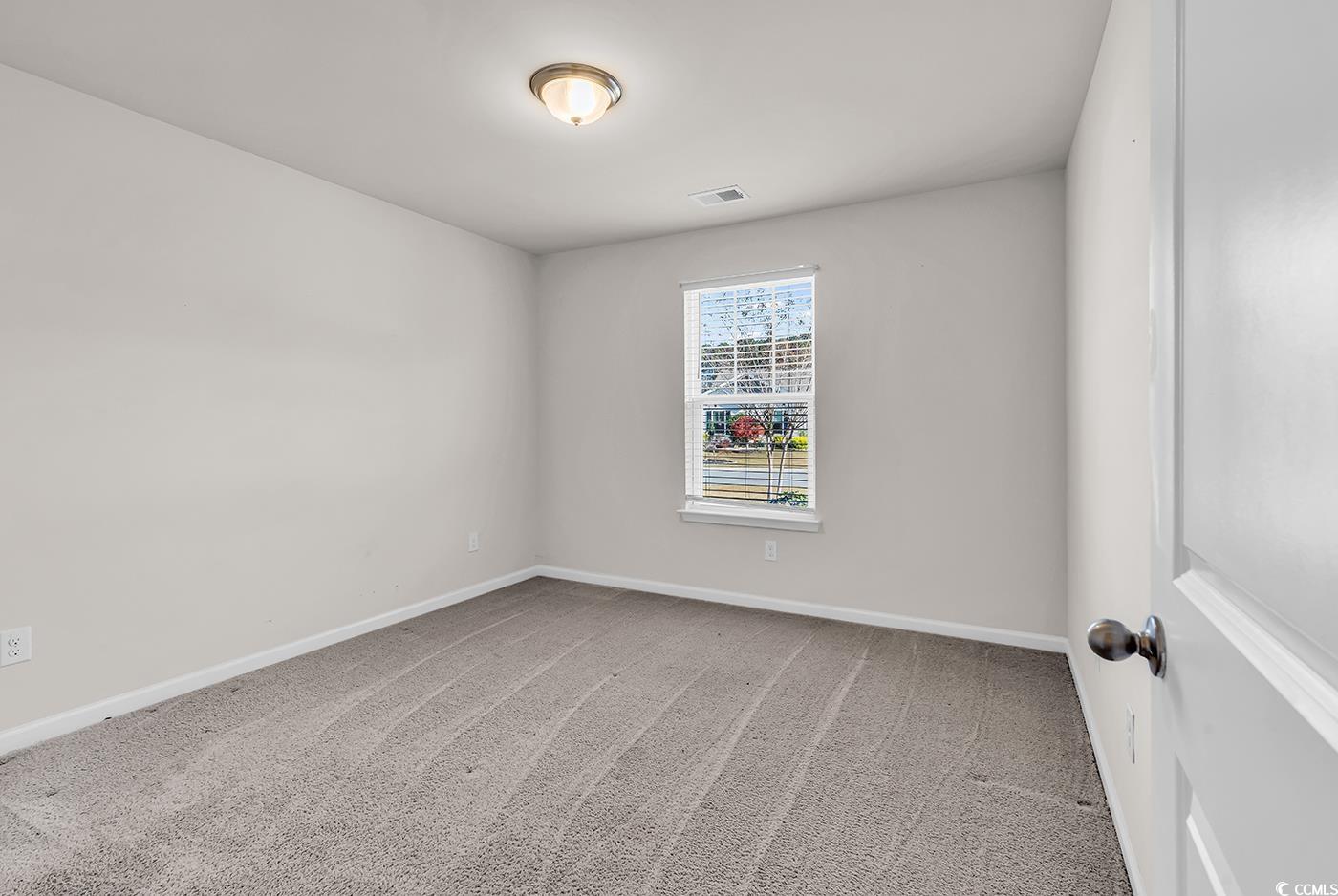 623 Burnt Ash Drive Longs, SC 29568 - Photo 16 of 35 Unfurnished bedroom with carpet floors and a closet