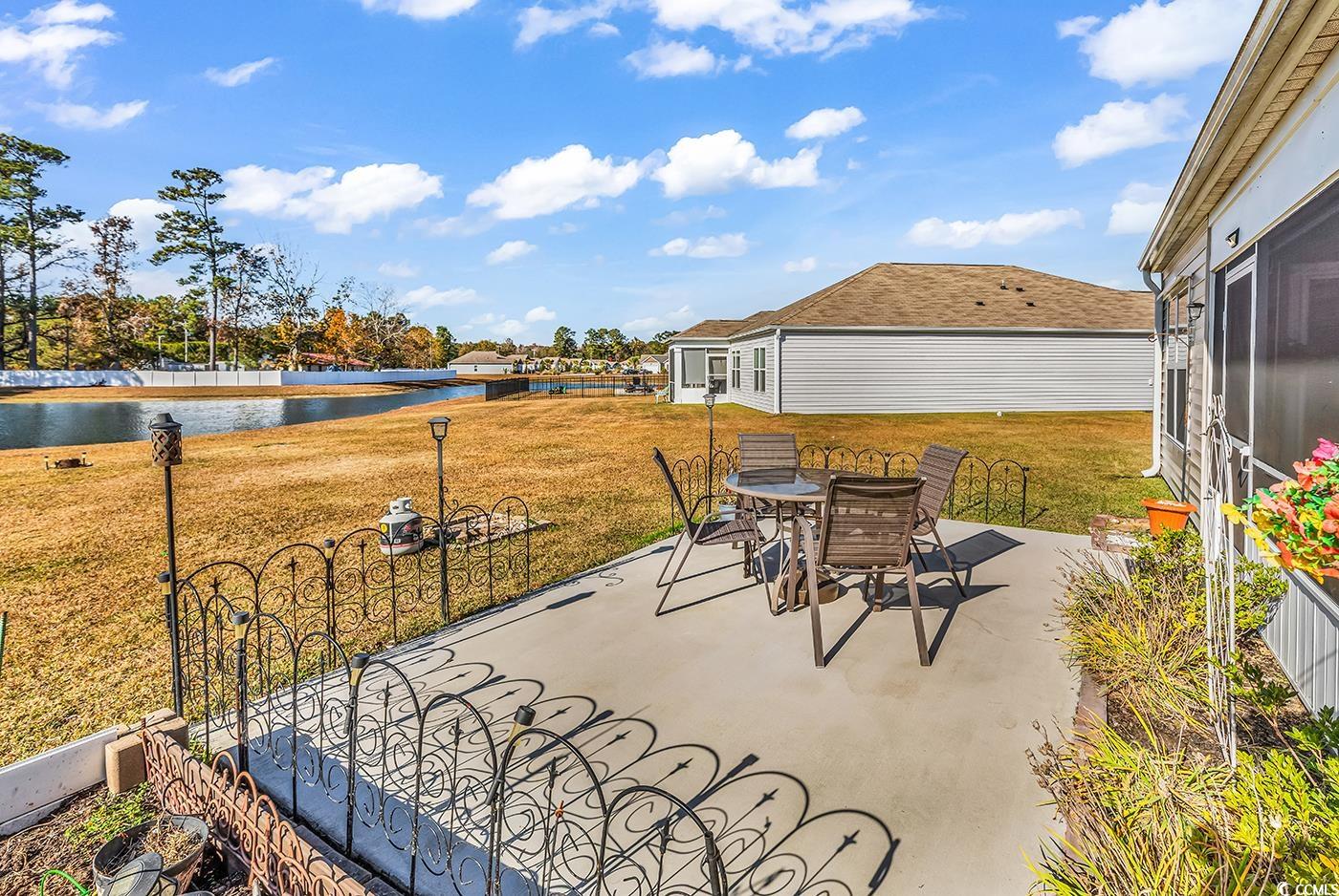 623 Burnt Ash Drive Longs, SC 29568 - Photo 24 of 35 View of patio with a water view and outdoor dining space