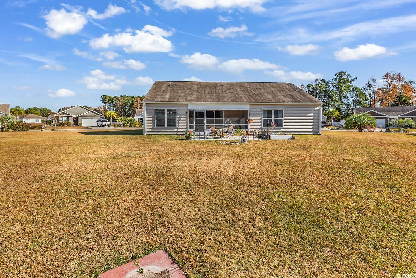 623 Burnt Ash Drive Longs, SC 29568 - Photo 27 of 35 Craftsman-style house featuring a front lawn, concrete driveway, and an attached garage