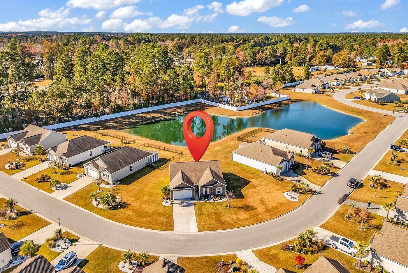 623 Burnt Ash Drive Longs, SC 29568 - Photo 31 of 35 Aerial perspective of suburban area featuring a heavily wooded area and a nearby body of water