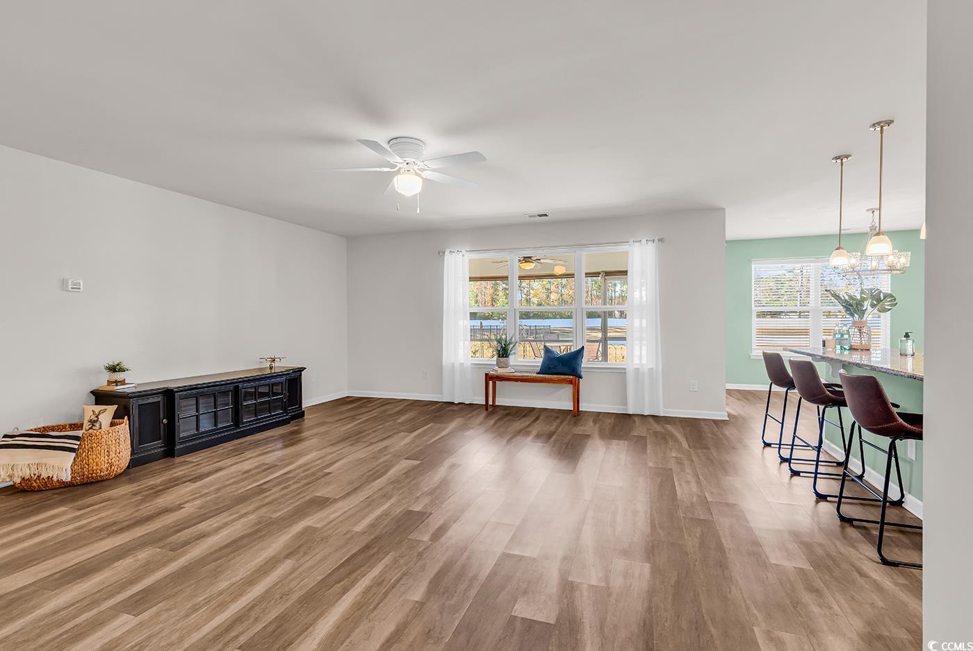 623 Burnt Ash Drive Longs, SC 29568 - Photo 9 of 35 Living room with light wood finished floors, plenty of natural light, and ceiling fan