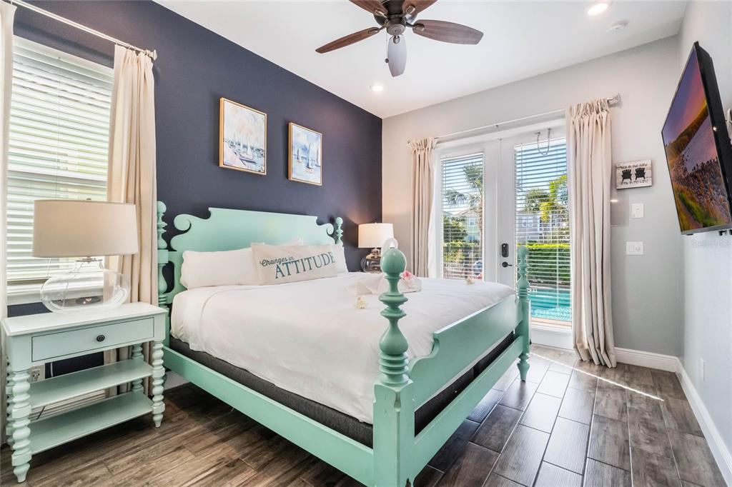 8008 Sandy Toes Way Kissimmee, FL 34747 - Photo 11 of 21 a bed sitting in a bedroom next to a window
