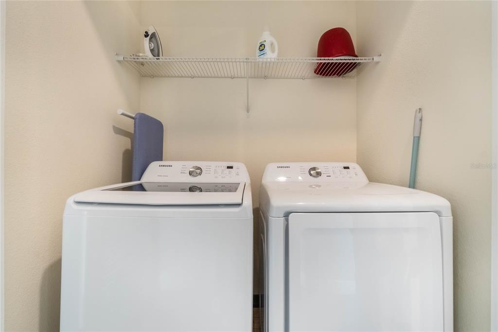 8008 Sandy Toes Way Kissimmee, FL 34747 - Photo 18 of 21 a utility room with dryer and washer