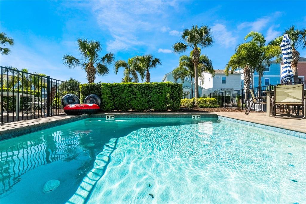 8008 Sandy Toes Way Kissimmee, FL 34747 - Photo 20 of 21 a front view of a house with garden