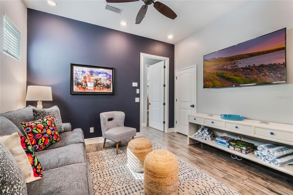 8008 Sandy Toes Way Kissimmee, FL 34747 - Photo 3 of 21 a living room with furniture and a window