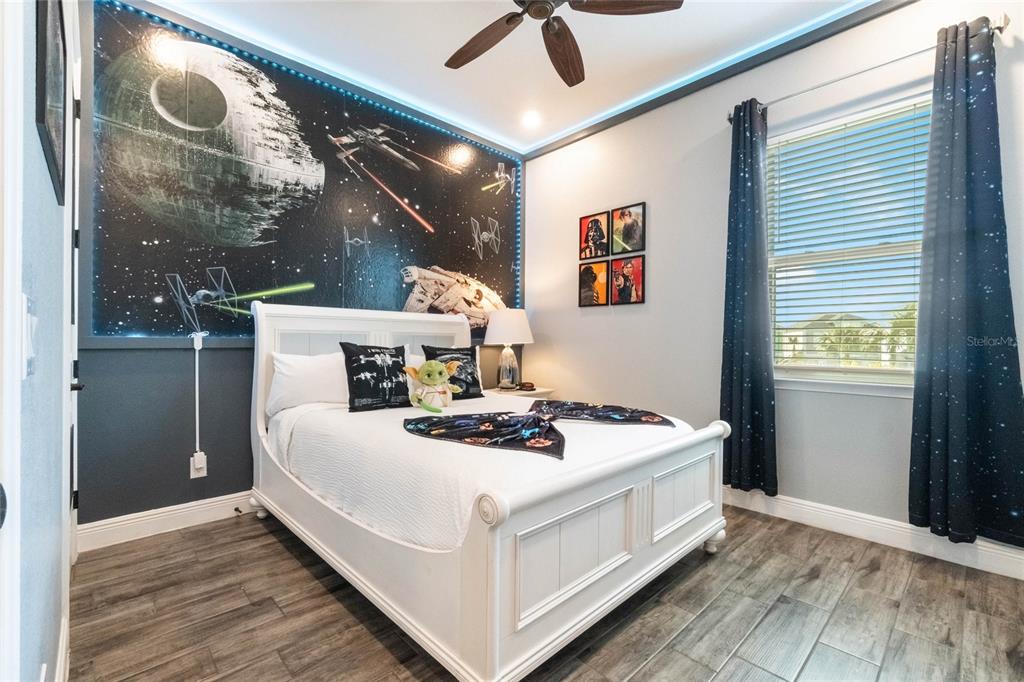 8008 Sandy Toes Way Kissimmee, FL 34747 - Photo 6 of 21 a bedroom with a bed and a window