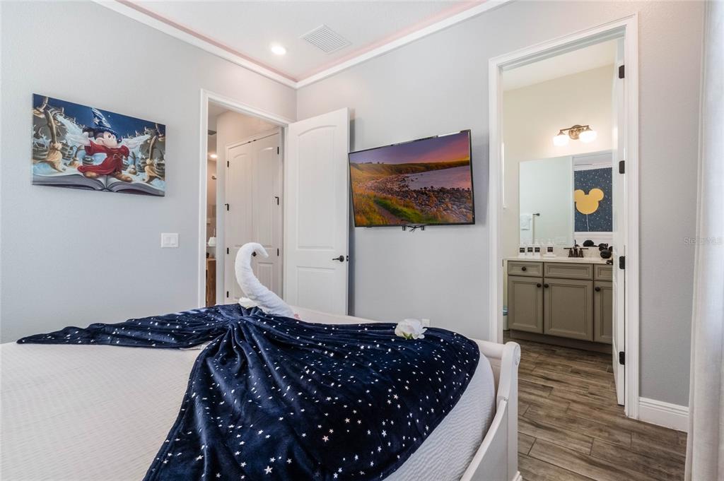 8008 Sandy Toes Way Kissimmee, FL 34747 - Photo 10 of 21 a bedroom with a bed and a view of bathroom