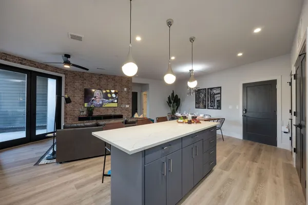 a living room with a sink furniture and a fireplace
