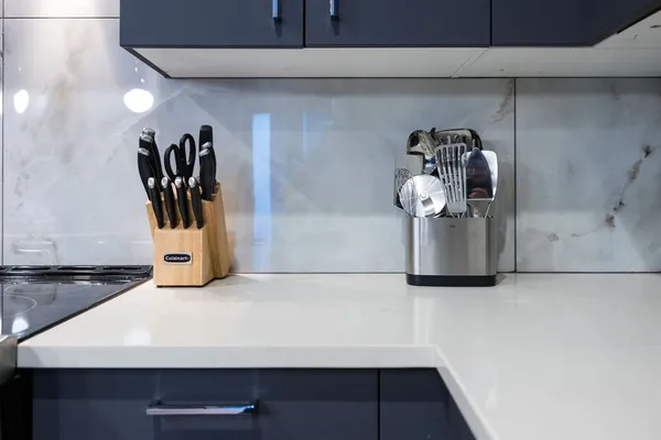 a view of a dining room with furniture and a chandelier fan
