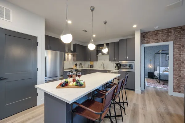 a kitchen with a table and chairs in it