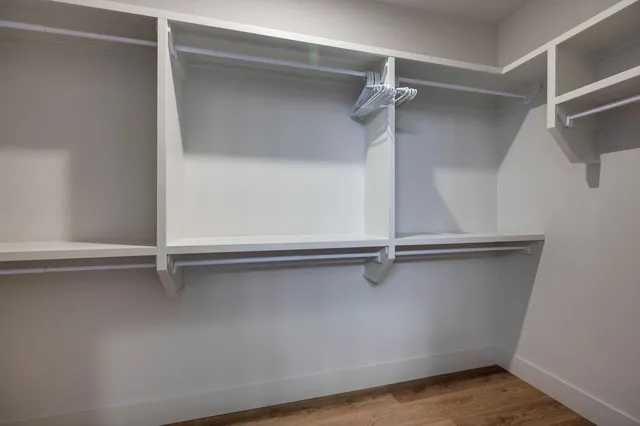 a room with gym equipment and a large window