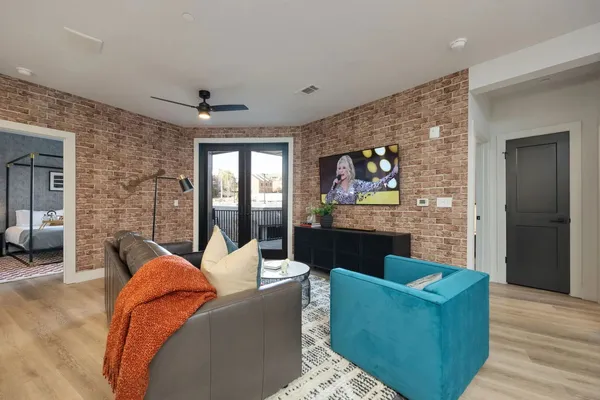 a large kitchen with kitchen island a sink a counter space and stainless steel appliances