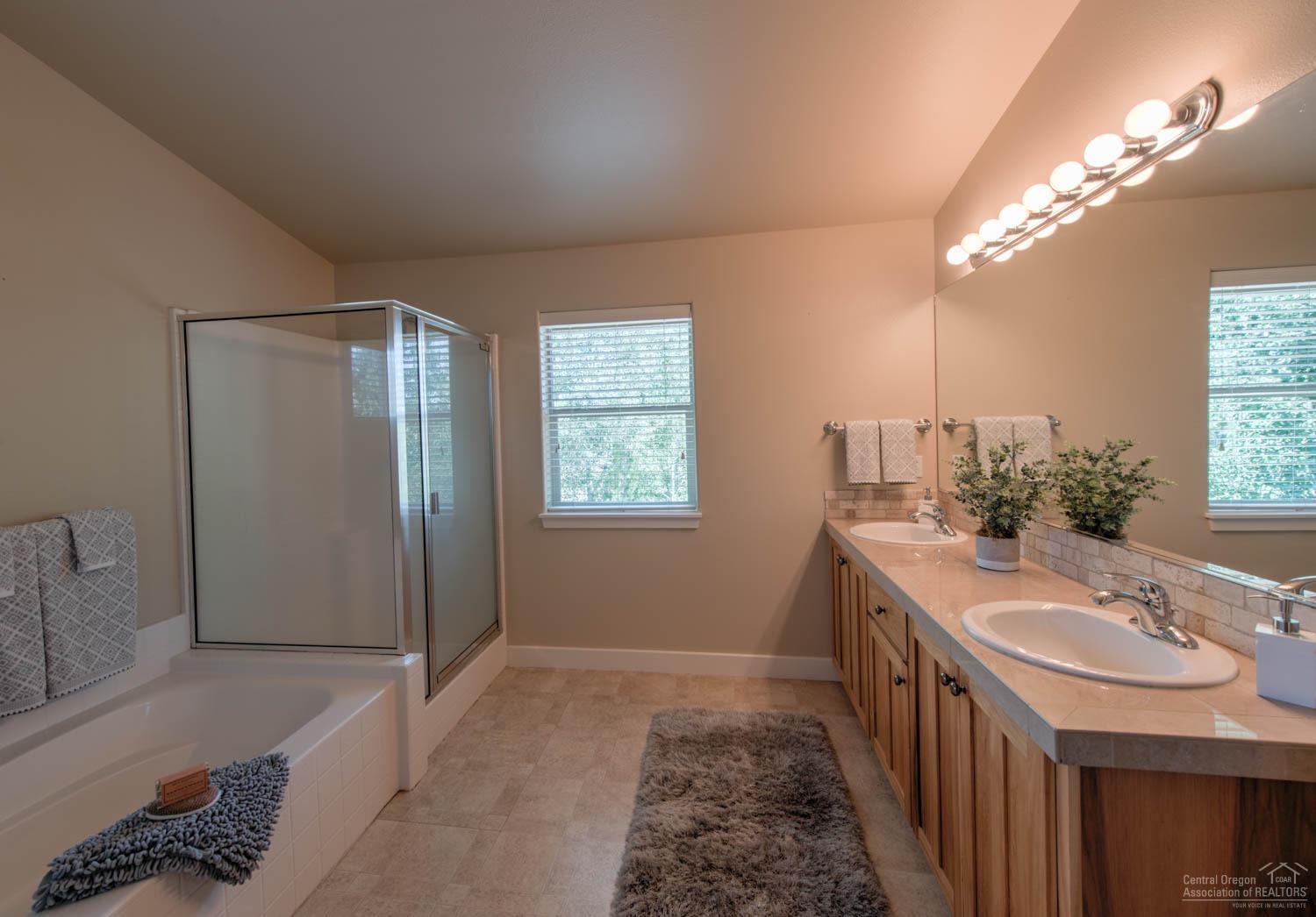 61915 Fall Creek Loop Bend, OR 97702 - Photo 16 of 24 The upstairs master bathroom is big and