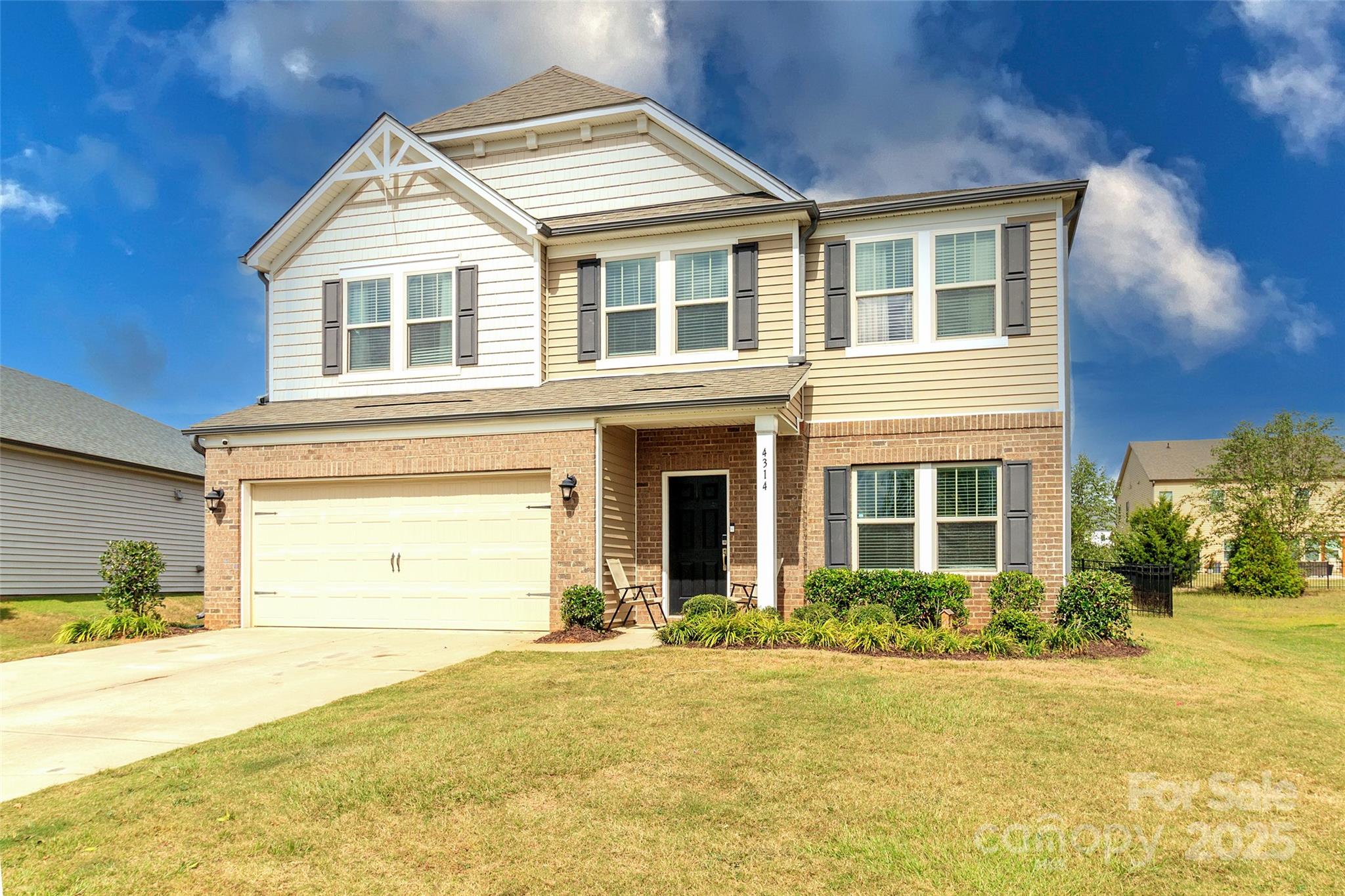 4314 Collingham Drive Charlotte, NC 28273 - Photo 1 of 46 a front view of a house with a yard and garage