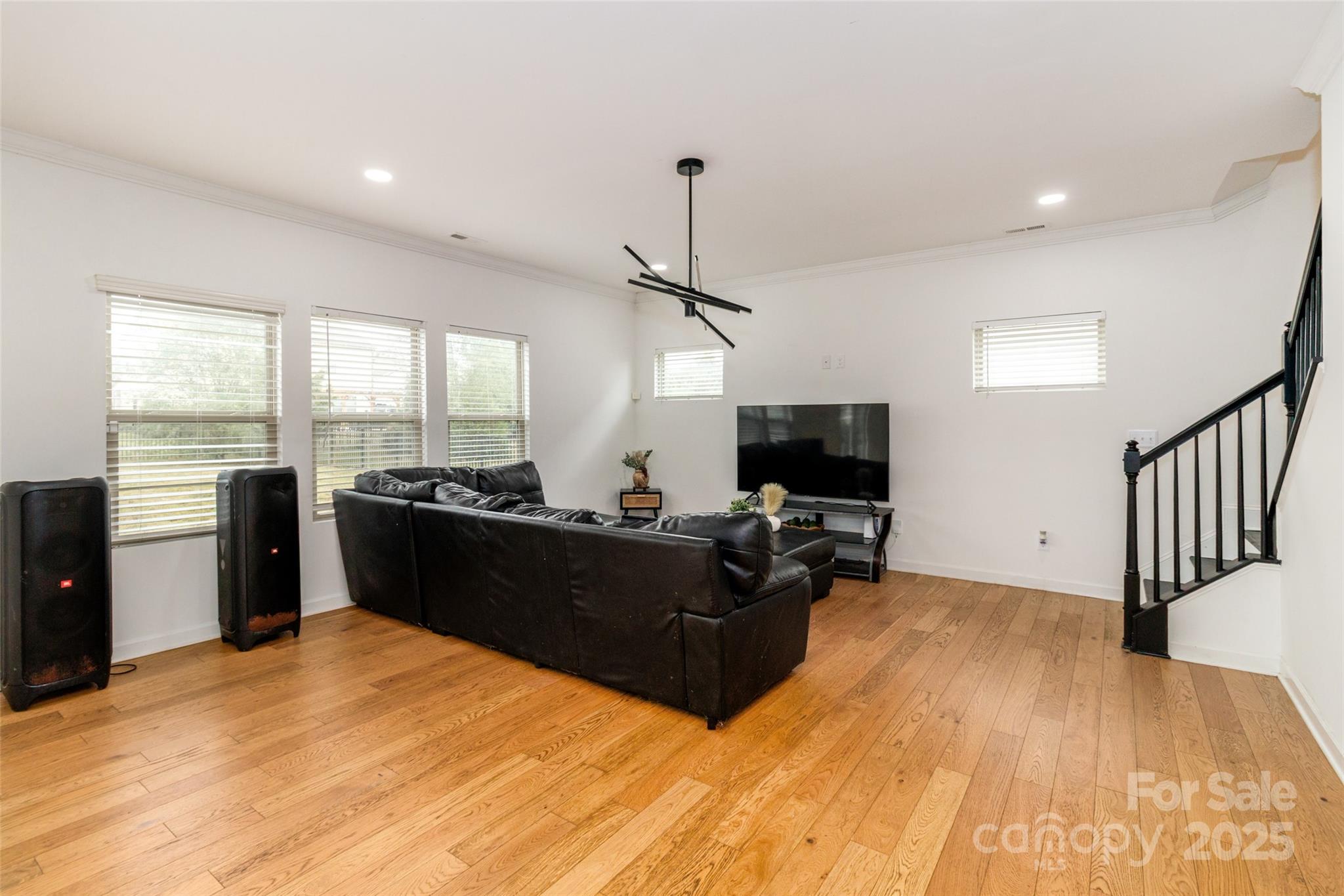 4314 Collingham Drive Charlotte, NC 28273 - Photo 12 of 46 a living room with furniture and a flat screen tv