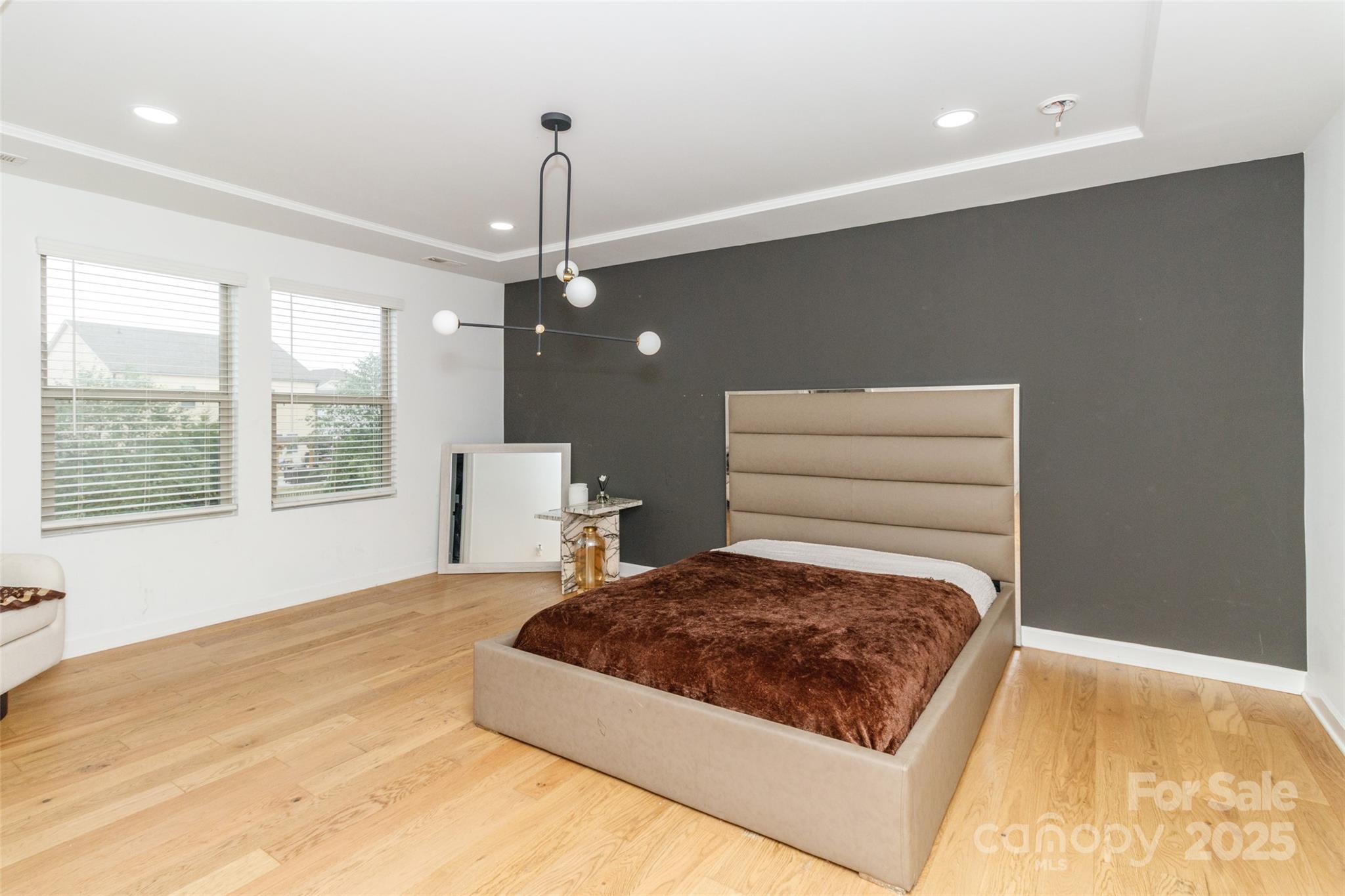 4314 Collingham Drive Charlotte, NC 28273 - Photo 19 of 46 a bedroom with a bed window and walk in closet with a large window