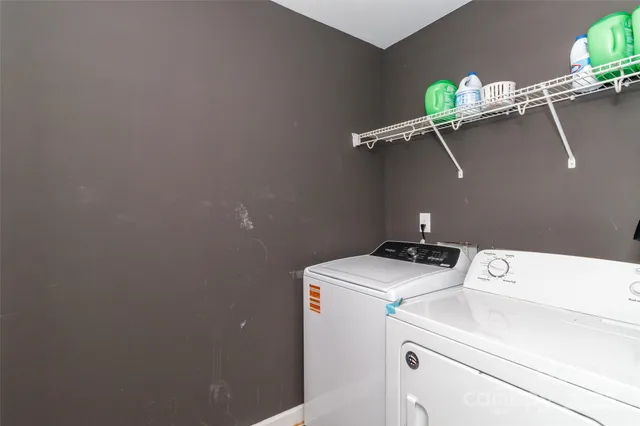 a spacious bedroom with a bed and a window