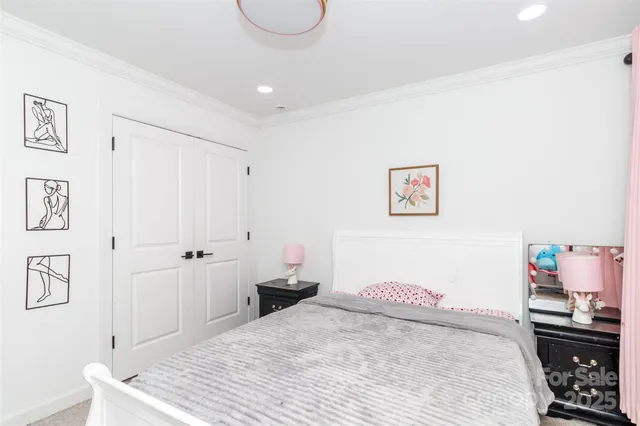 a bedroom with a bed and a desk