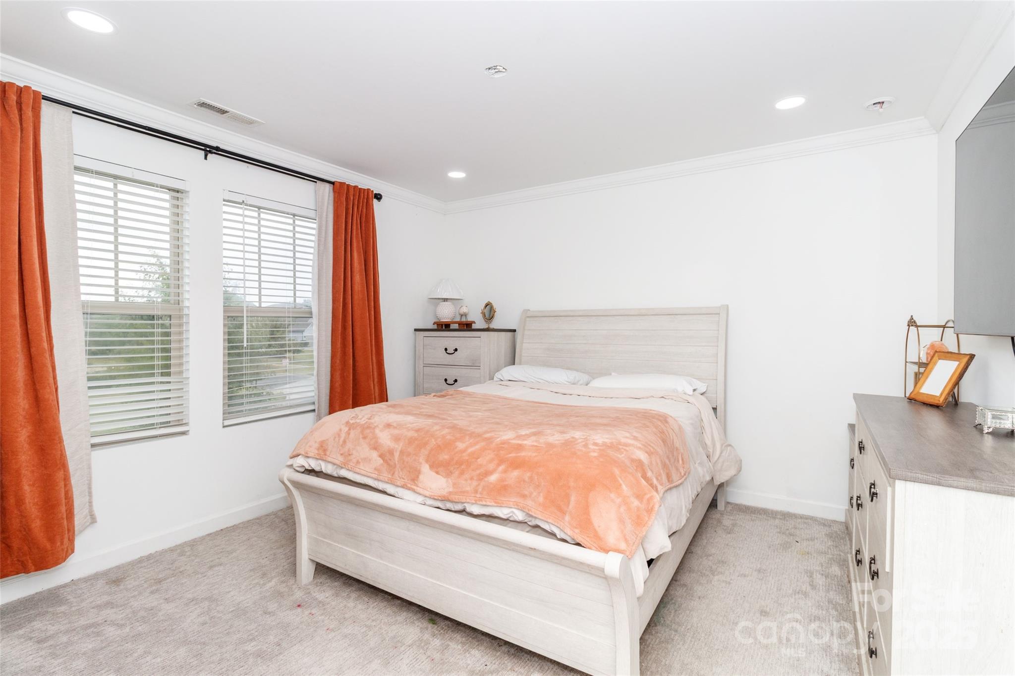 4314 Collingham Drive Charlotte, NC 28273 - Photo 32 of 46 a large bed sitting in a bedroom next to a window