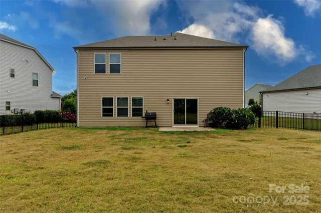 a view of a patio with a yard