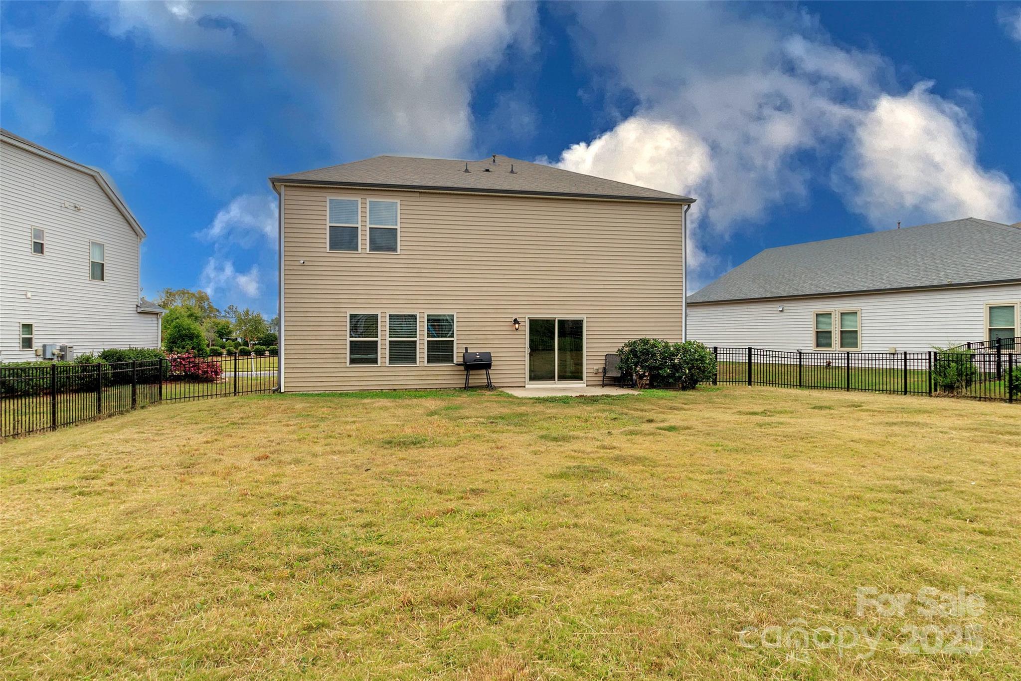 4314 Collingham Drive Charlotte, NC 28273 - Photo 39 of 46 a backyard of a house with table and chairs