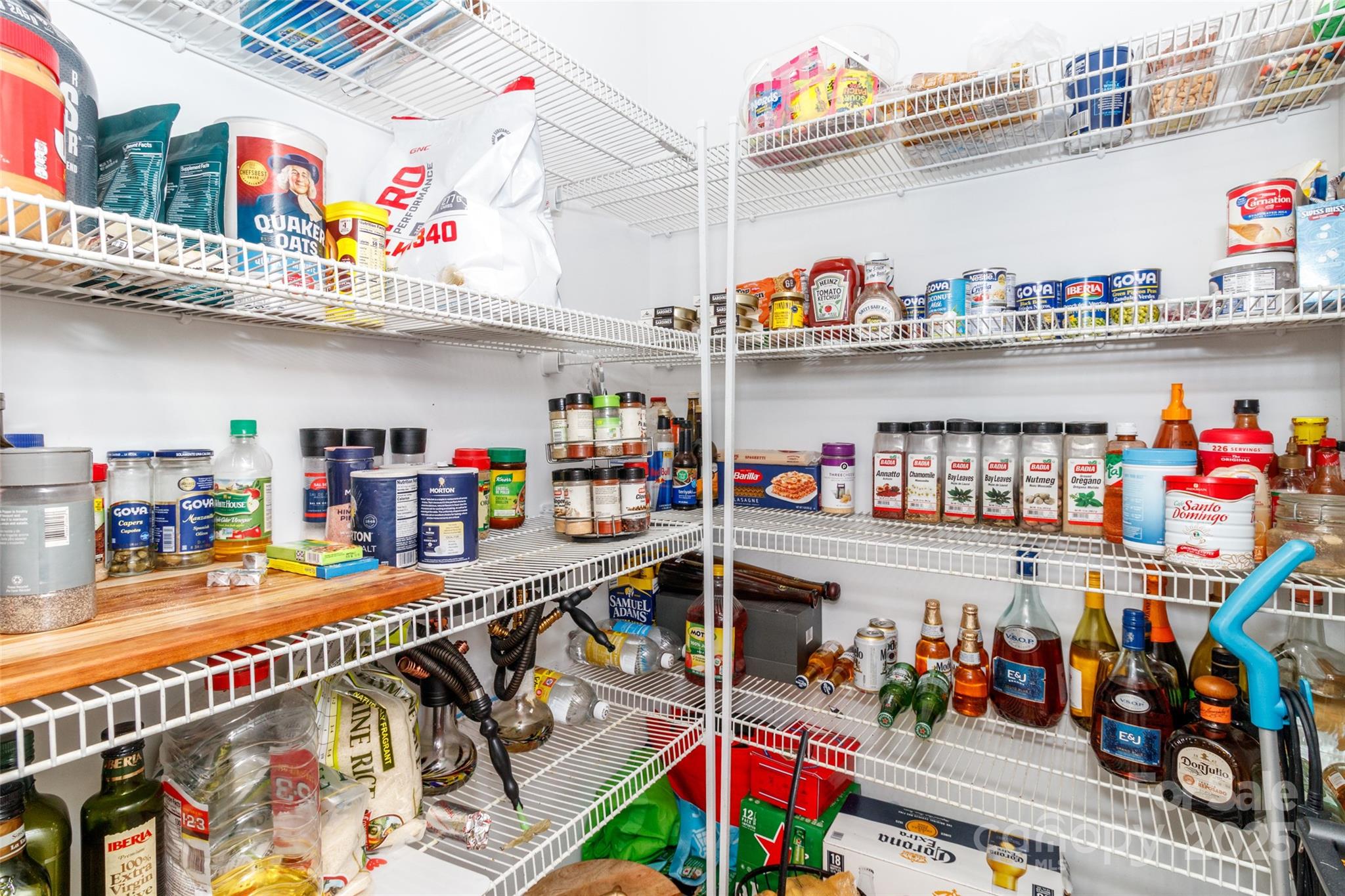 4314 Collingham Drive Charlotte, NC 28273 - Photo 9 of 46 a store room with lots of clutter and stainless steel appliances