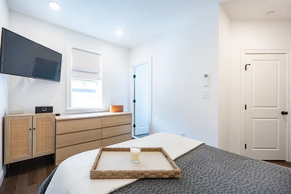 a room with a bed and a window