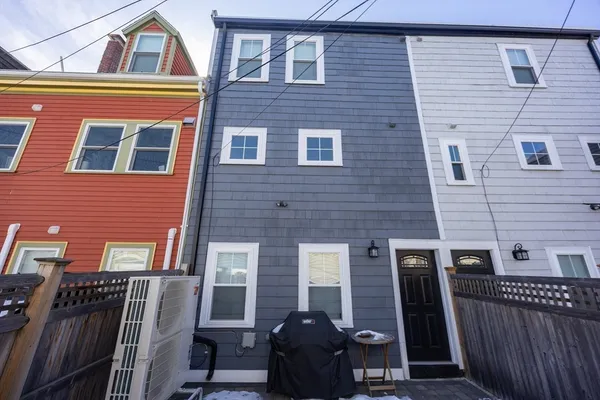 a view of a chairs and a car park in front of a house