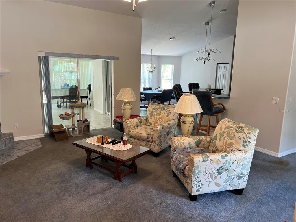 1995 East Newhaven Street Inverness, FL 34453 - Photo 6 of 48 a living room with furniture and a window
