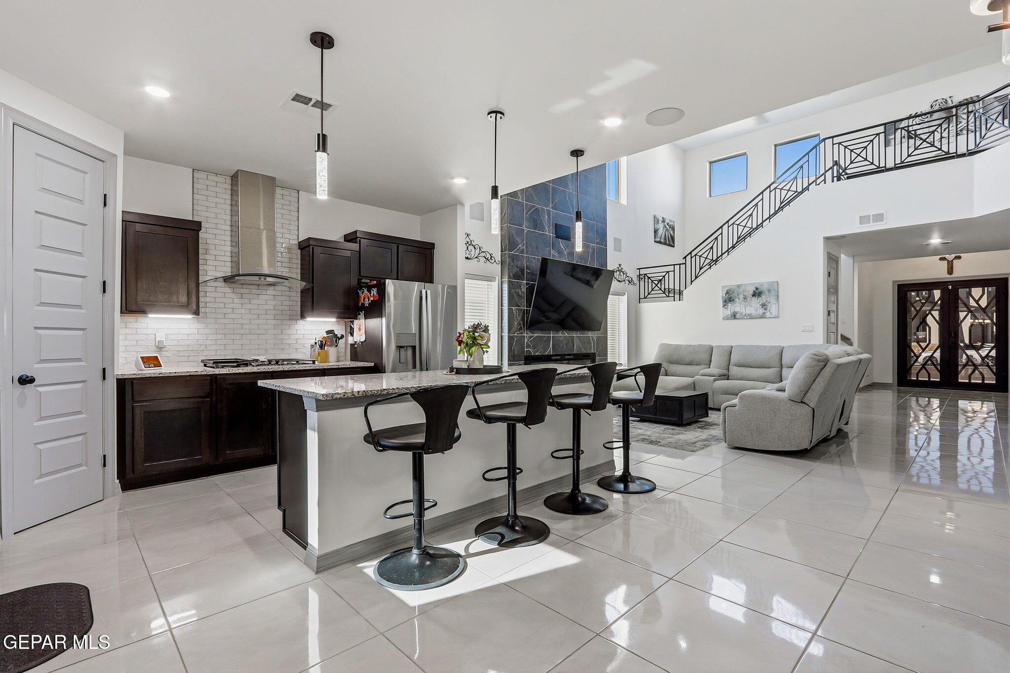 12892 Jonathan Raul El Paso, TX 79928 - Photo 11 of 53 a kitchen with stainless steel appliances kitchen island granite countertop a sink and cabinets