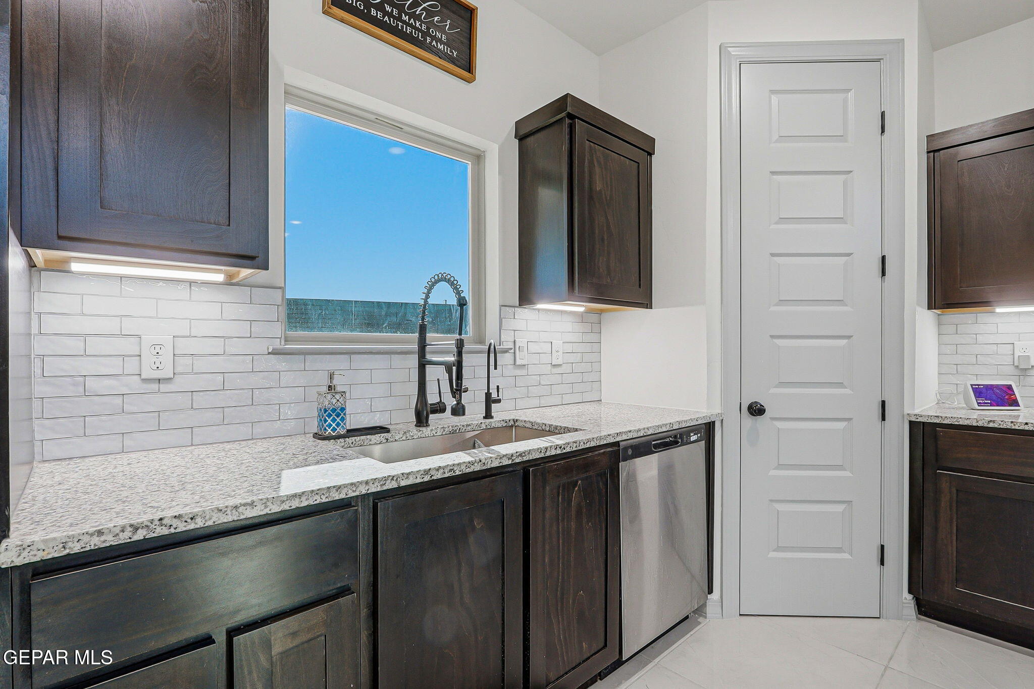 12892 Jonathan Raul El Paso, TX 79928 - Photo 12 of 53 a kitchen with granite countertop a sink and cabinets