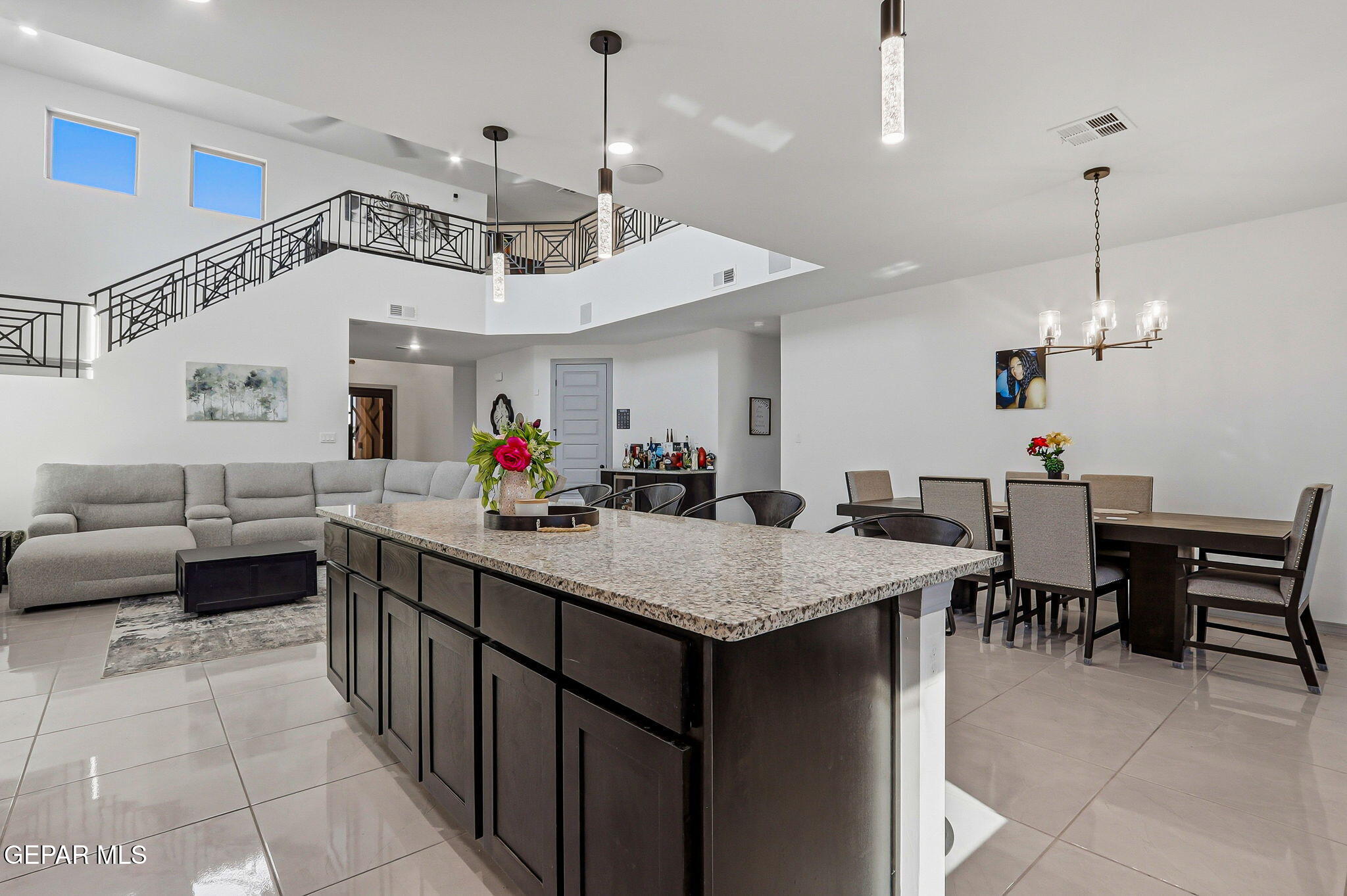 12892 Jonathan Raul El Paso, TX 79928 - Photo 14 of 53 a kitchen with kitchen island a sink dining table and chairs