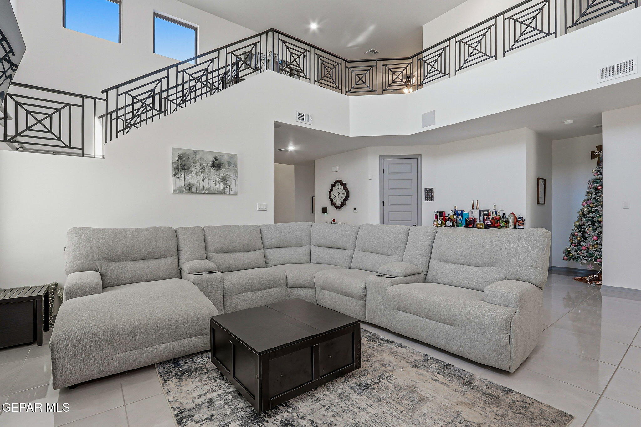 12892 Jonathan Raul El Paso, TX 79928 - Photo 21 of 53 a living room with furniture and a chandelier