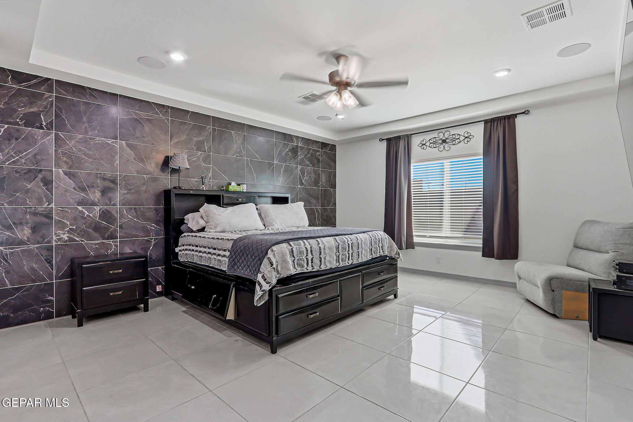 12892 Jonathan Raul El Paso, TX 79928 - Photo 25 of 53 a bedroom with a bed and a ceiling fan