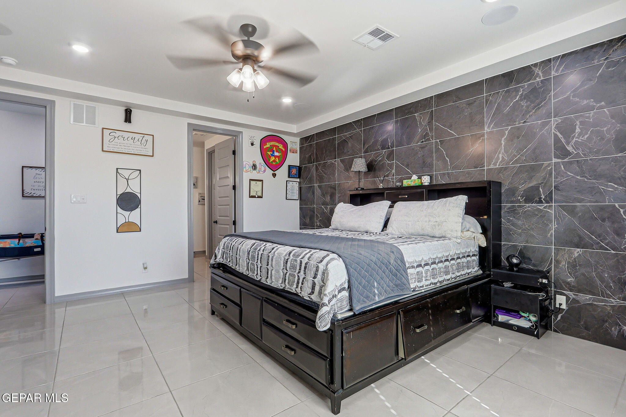 12892 Jonathan Raul El Paso, TX 79928 - Photo 26 of 53 a bed room with a bed and a ceiling fan