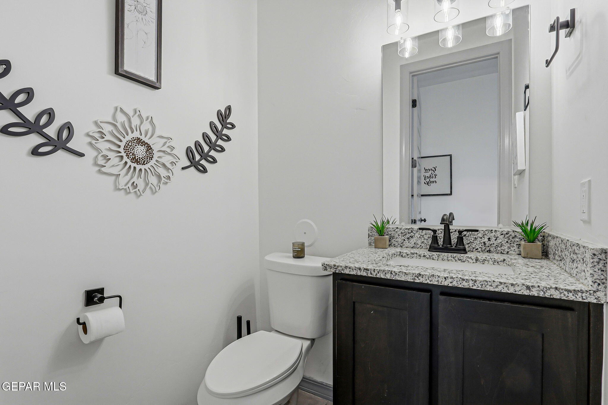 12892 Jonathan Raul El Paso, TX 79928 - Photo 31 of 53 a bathroom with a granite countertop sink mirror vanity and toilet