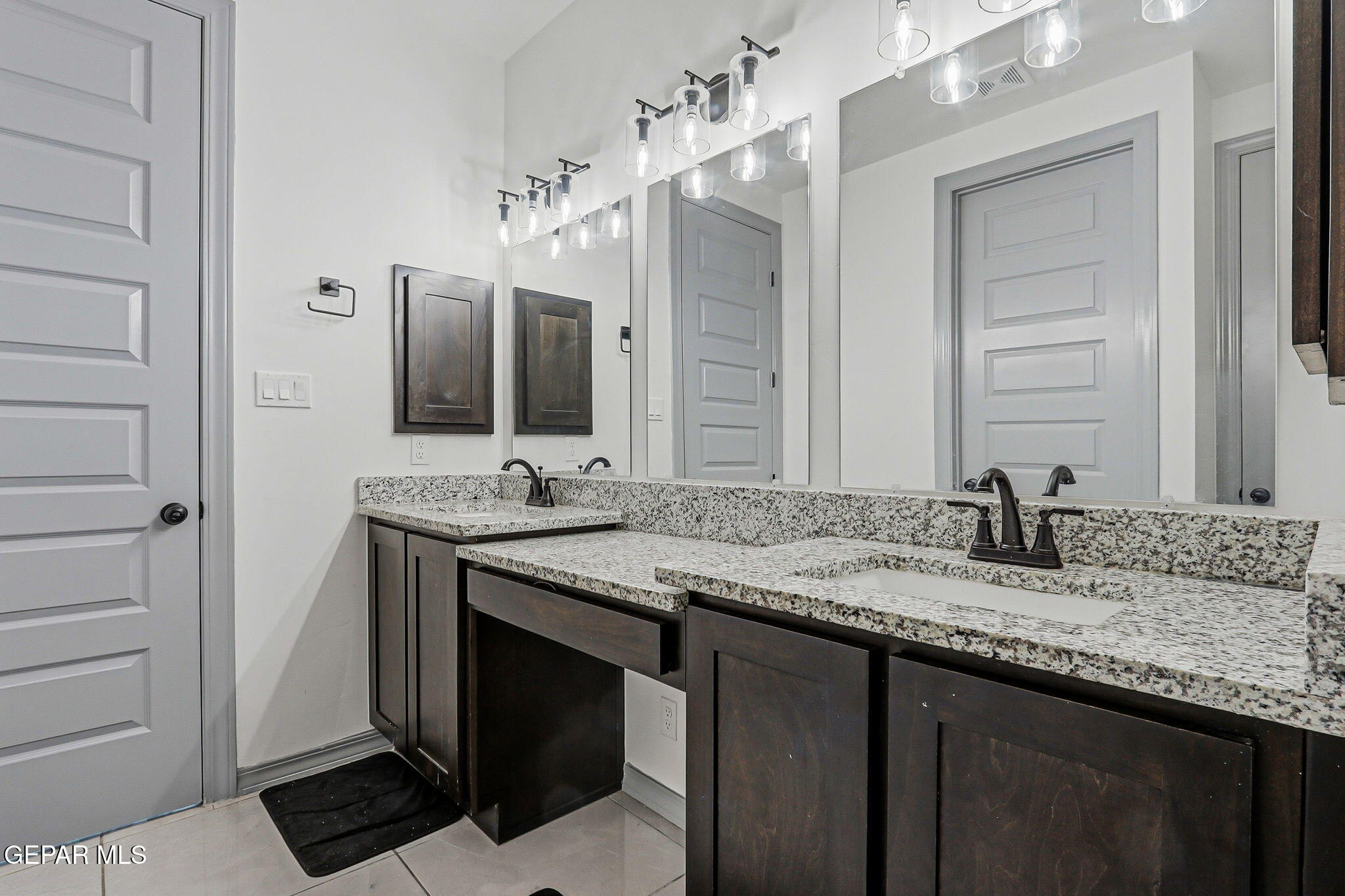 12892 Jonathan Raul El Paso, TX 79928 - Photo 32 of 53 a bathroom with a granite countertop sink double and mirror