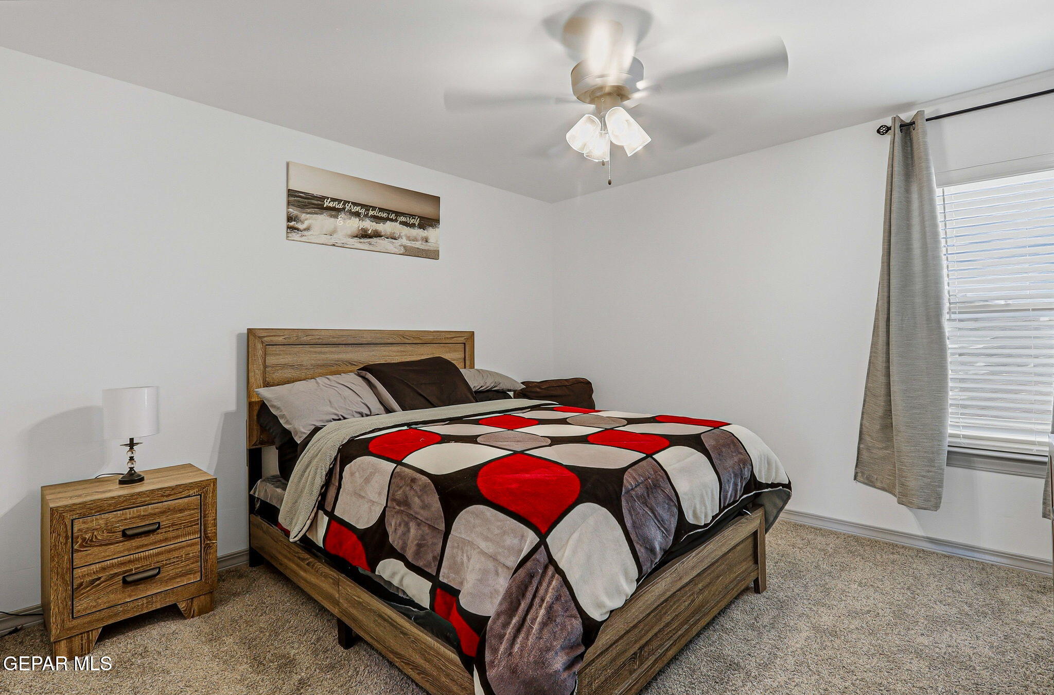12892 Jonathan Raul El Paso, TX 79928 - Photo 42 of 53 a bedroom with a bed and a chandelier